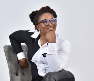 Bukola Jolugbo in casual attire, sharing educational resources and books